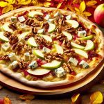Une pizza garnie de tranches de pommes, de morceaux de gorgonzola et de noix, posée sur une table rustique avec des feuilles d'automne en arrière-plan.